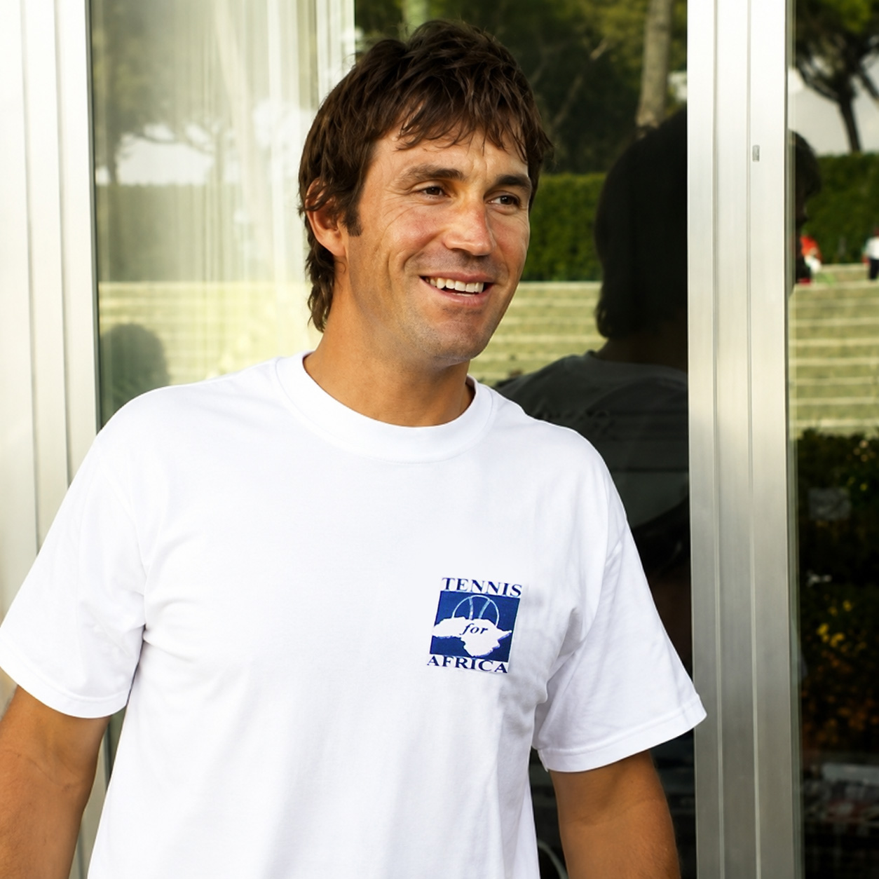 Pat Cash con T-shirt Tennis for Africa